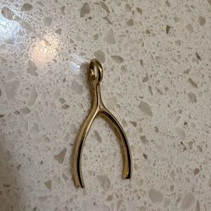 Gold wishbone charm